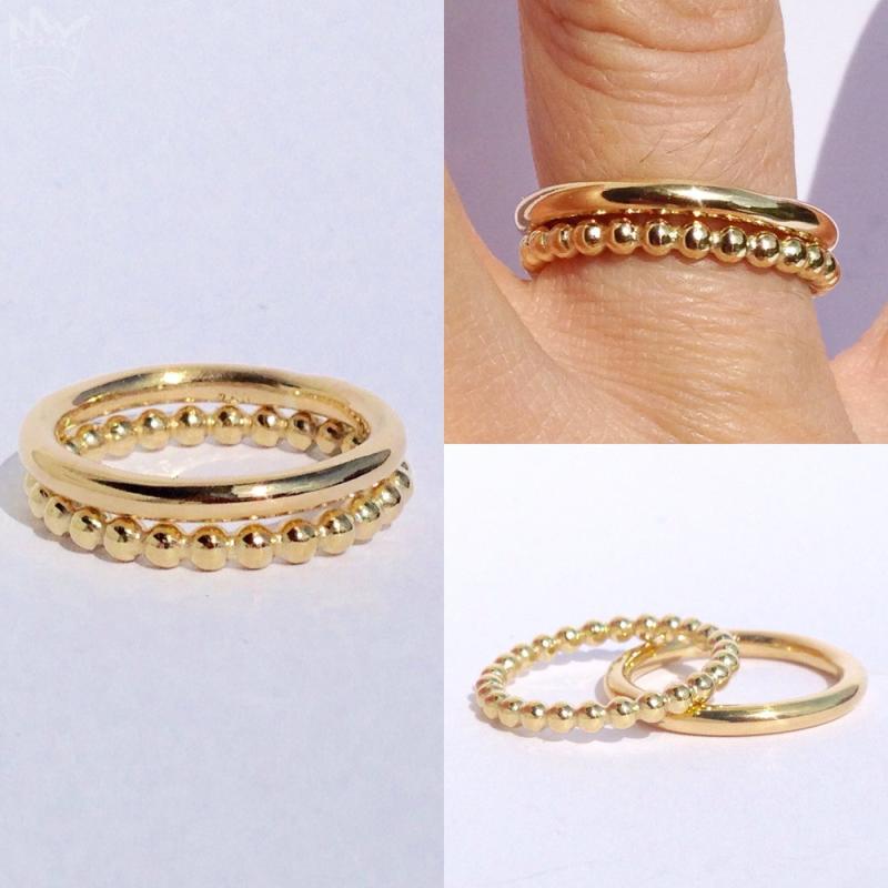 Eine sehr exclusive und edle 2er-Kombi aus 18kt Gelbgold. Ein glatter (rundes Ringprofil) und ein Kugelring bilden diese zauberhafte Kombination.