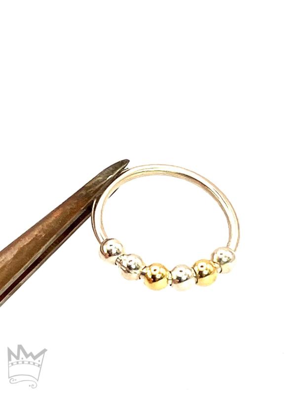 Fidgetring mit 2 Gold - und 4 Silberkugeln